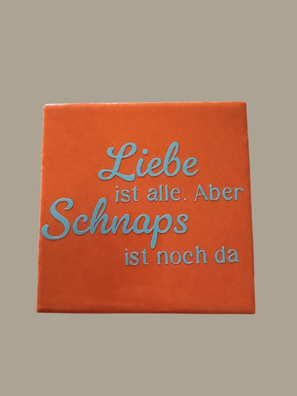 Spruch-Kachel – „Liebe ist alle , aber Schnaps ist noch da. „