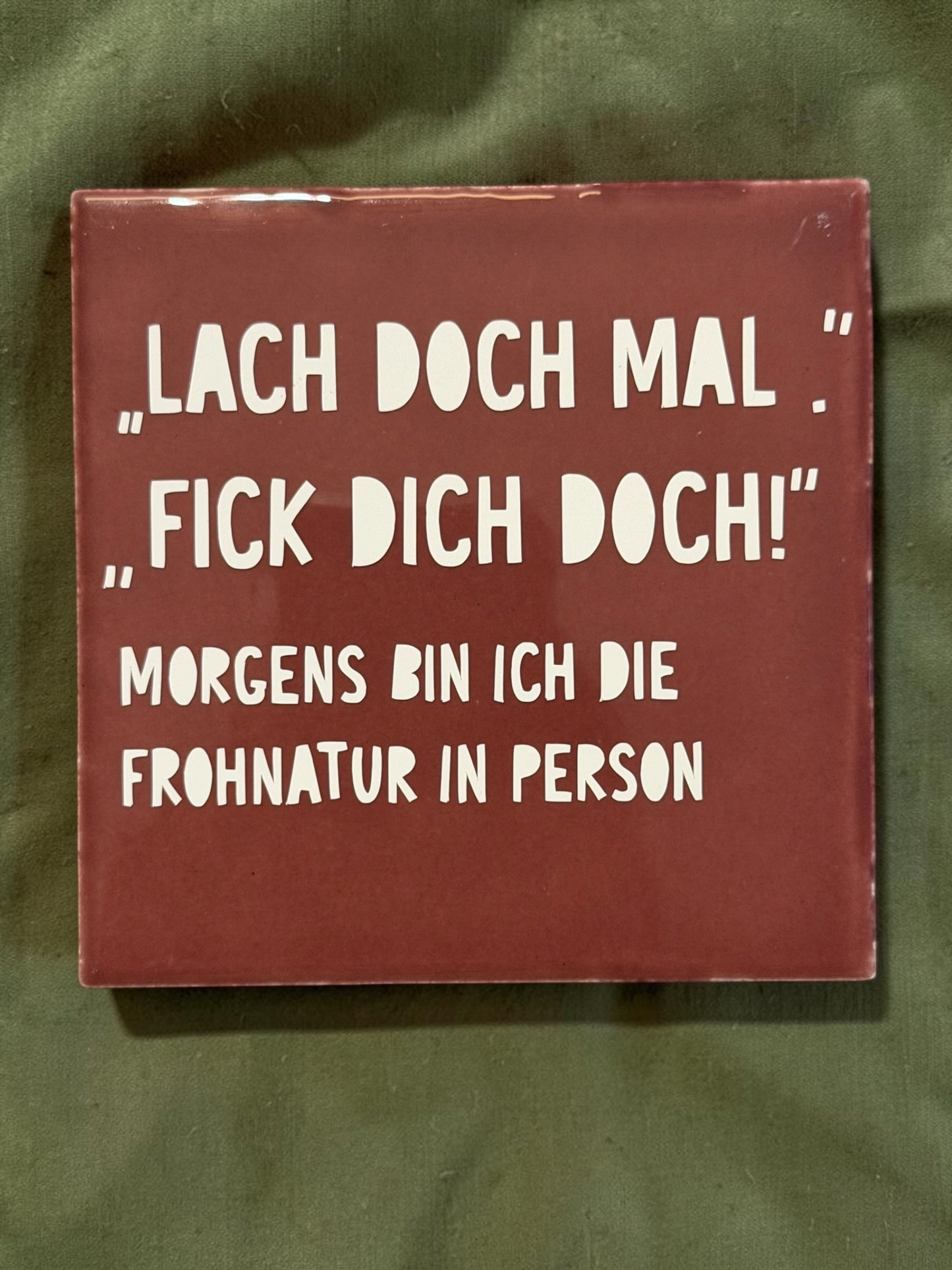 Spruch-Kachel – „Lach doch mal, fick dich doch "